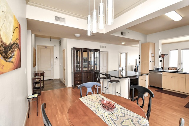 3505 Sage Rd Unit 2910, Houston, TX 77056 - dining room featuring wood finished floors, wine cooler, and ornamental molding