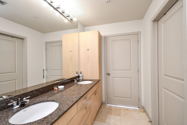 3505 Sage Rd Unit 2910, Houston, TX 77056 - bathroom featuring double vanity and tile patterned flooring