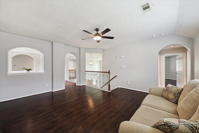 2332 Shadow Falls Ln, Pearland, TX 77584 - living area with ceiling fan, arched walkways, wood finished floors, and a textured ceiling