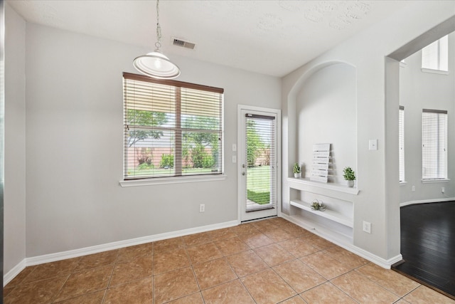 2332 Shadow Falls Ln, Pearland, TX 77584 - entryway with light tile patterned floors and baseboards