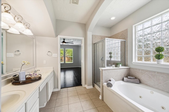 2332 Shadow Falls Ln, Pearland, TX 77584 - bathroom with a shower stall, a jetted tub, double vanity, and tile patterned flooring