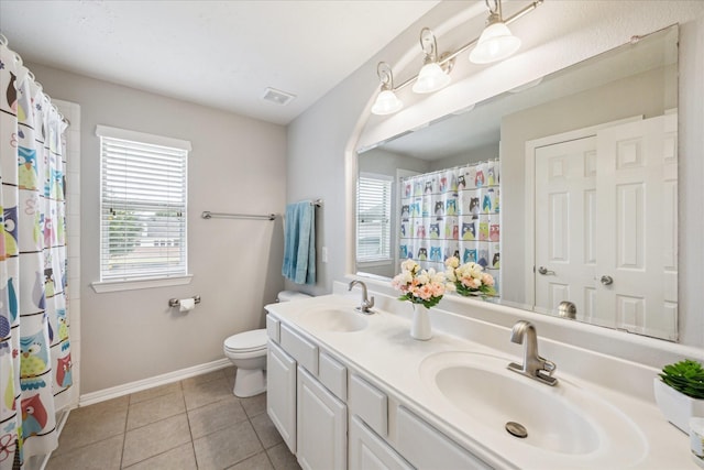 2332 Shadow Falls Ln, Pearland, TX 77584 - bathroom with plenty of natural light, double vanity, tile patterned floors, and a shower with curtain