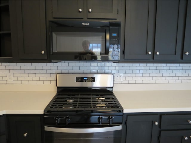 11918 Sagedowne Ln, Houston, TX 77089 - kitchen with black microwave, gas range, decorative backsplash, and light countertops