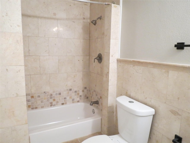 11918 Sagedowne Ln, Houston, TX 77089 - full bathroom with washtub / shower combination, tile walls, and wainscoting