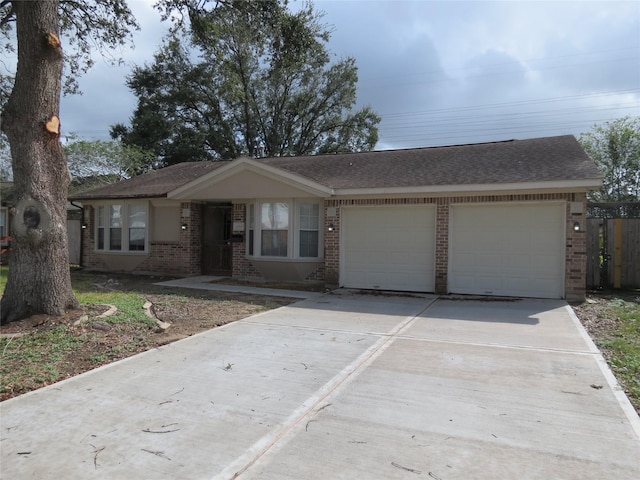 11918 Sagedowne Ln, Houston, TX 77089 - ranch-style house featuring brick siding, a garage, concrete driveway, and roof with shingles
