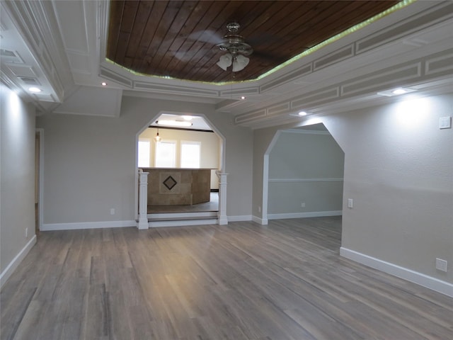 11918 Sagedowne Ln, Houston, TX 77089 - unfurnished living room featuring wood ceiling, wood finished floors, ceiling fan, and arched walkways