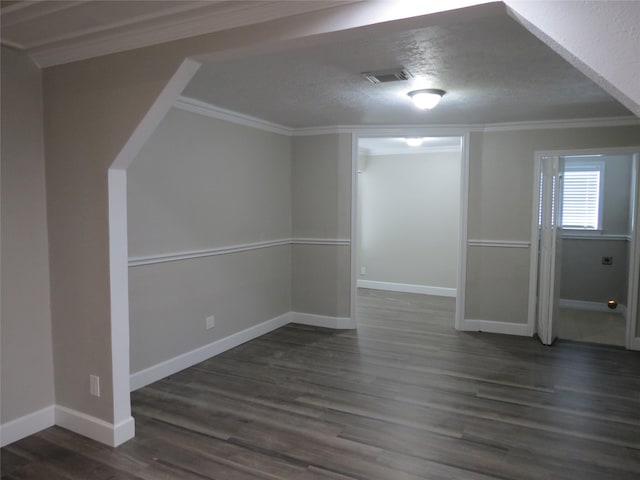 11918 Sagedowne Ln, Houston, TX 77089 - empty room featuring dark wood-style floors, crown molding, and a textured ceiling