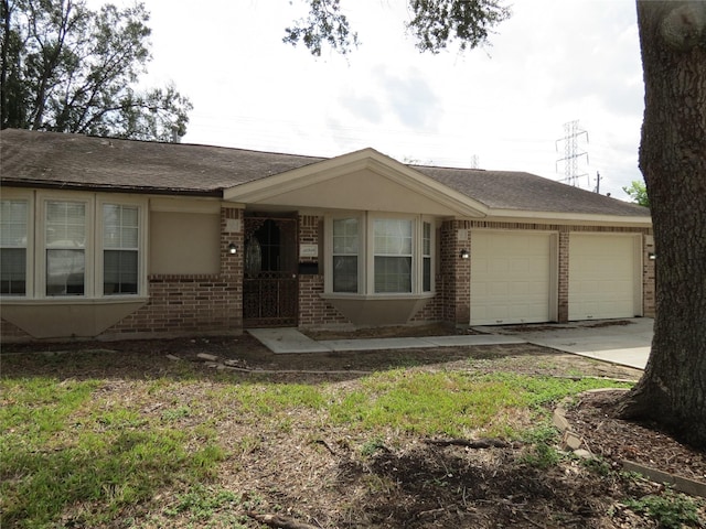 11918 Sagedowne Ln, Houston, TX 77089 - ranch-style house with brick siding, an attached garage, concrete driveway, and a shingled roof