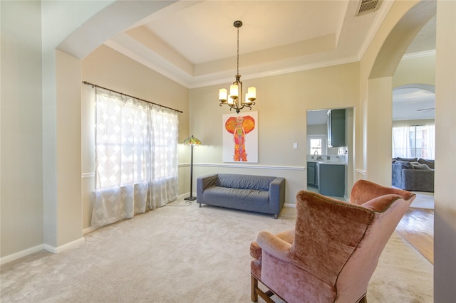 23742 Indian Hills Way, Katy, TX 77494 - sitting room with arched walkways, carpet flooring, a chandelier, crown molding, and a tray ceiling