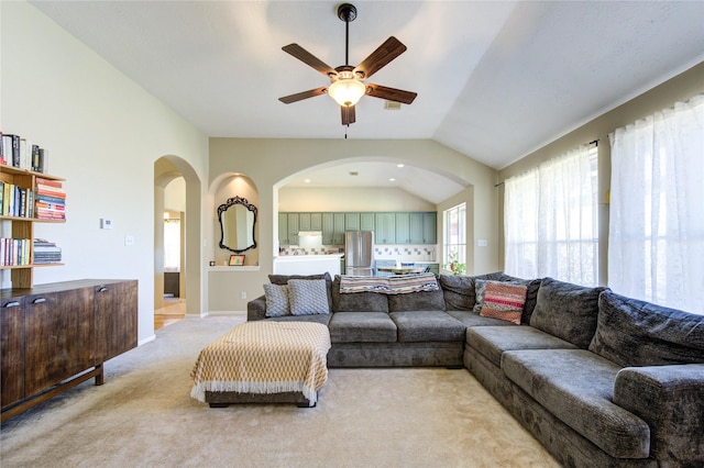 23742 Indian Hills Way, Katy, TX 77494 - living area with arched walkways, a ceiling fan, light colored carpet, and lofted ceiling