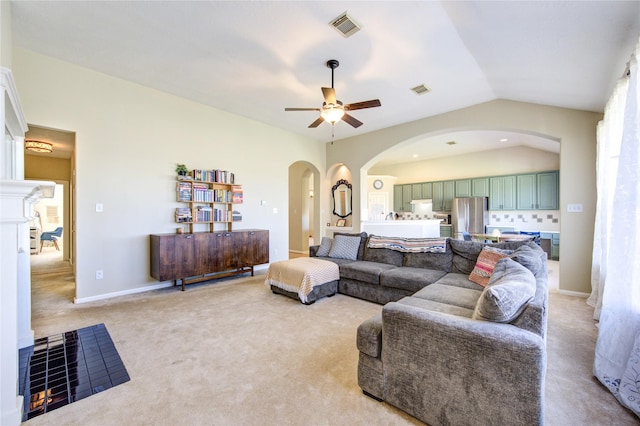 23742 Indian Hills Way, Katy, TX 77494 - living area with arched walkways, ceiling fan, light carpet, and vaulted ceiling