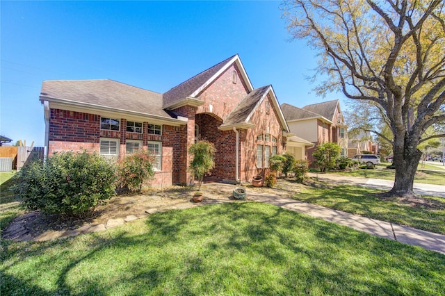 23742 Indian Hills Way, Katy, TX 77494 - view of front facade with brick siding and a front yard
