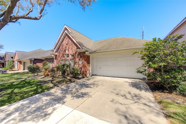 23742 Indian Hills Way, Katy, TX 77494 - view of front of property featuring brick siding, a garage, concrete driveway, and a shingled roof