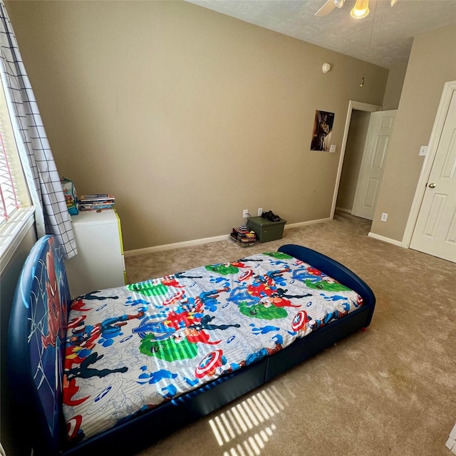 23742 Indian Hills Way, Katy, TX 77494 - carpeted bedroom with baseboards and a ceiling fan