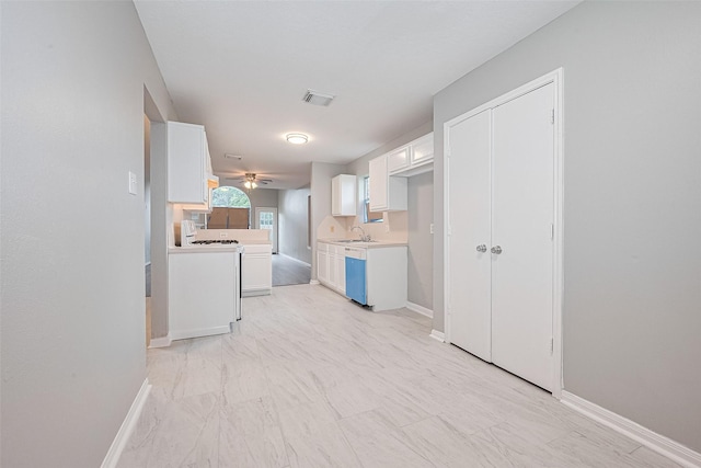1811 Elm Shadow Dr, Missouri City, TX 77489 - kitchen with white cabinetry, light countertops, a ceiling fan, and white stove
