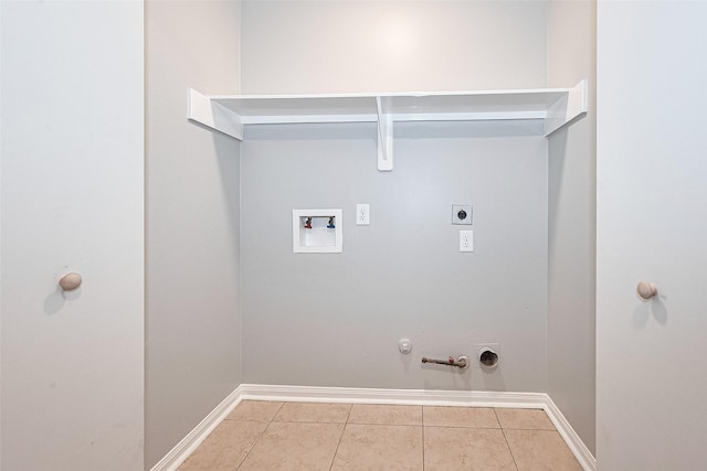 1811 Elm Shadow Dr, Missouri City, TX 77489 - laundry area with gas dryer hookup, electric dryer hookup, washer hookup, and tile patterned floors