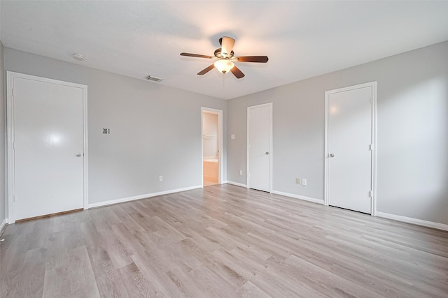 1811 Elm Shadow Dr, Missouri City, TX 77489 - unfurnished bedroom with light wood-type flooring, connected bathroom, and ceiling fan