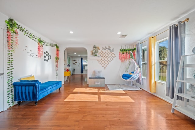 16815 Watering Oaks Ln, Houston, TX 77083 - living area with arched walkways, wood finished floors, and recessed lighting