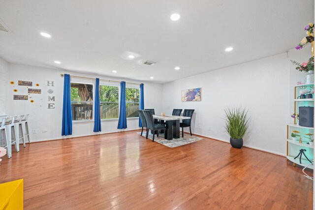 16815 Watering Oaks Ln, Houston, TX 77083 - dining room featuring light wood-style flooring and recessed lighting
