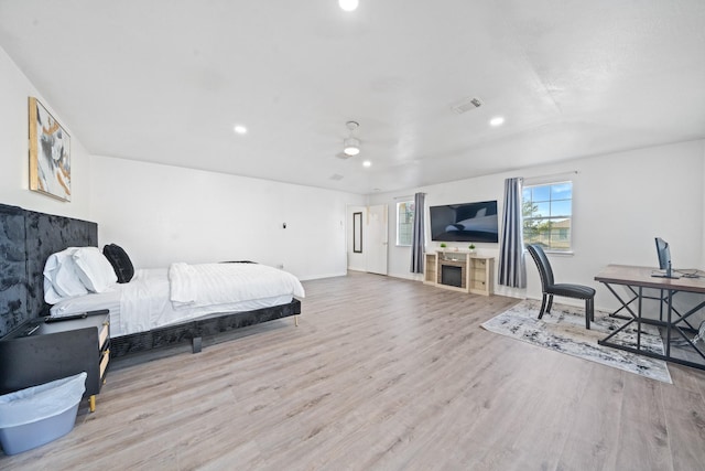 16815 Watering Oaks Ln, Houston, TX 77083 - bedroom with wood finished floors, recessed lighting, and an office area