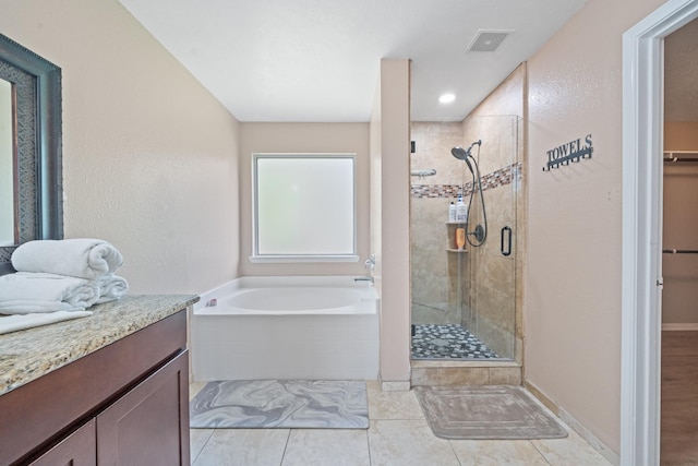 16815 Watering Oaks Ln, Houston, TX 77083 - full bath with a shower stall, a bath, a walk in closet, vanity, and tile patterned flooring