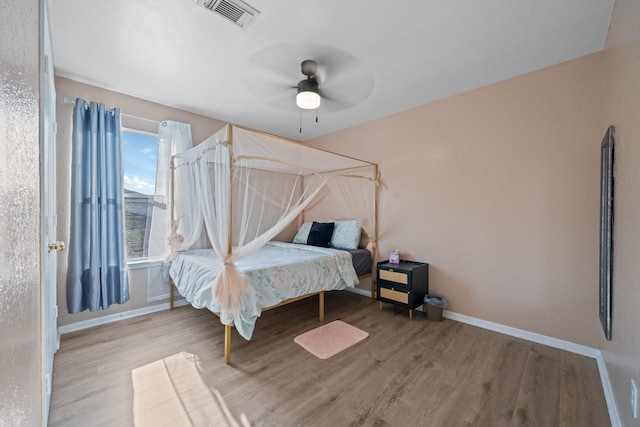16815 Watering Oaks Ln, Houston, TX 77083 - bedroom featuring wood finished floors and a ceiling fan