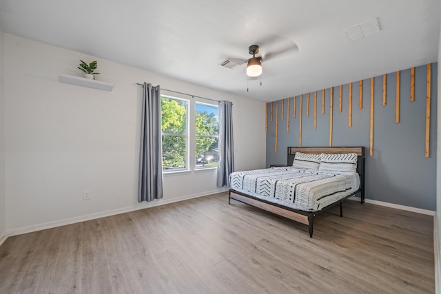 16815 Watering Oaks Ln, Houston, TX 77083 - bedroom with wood finished floors and a ceiling fan