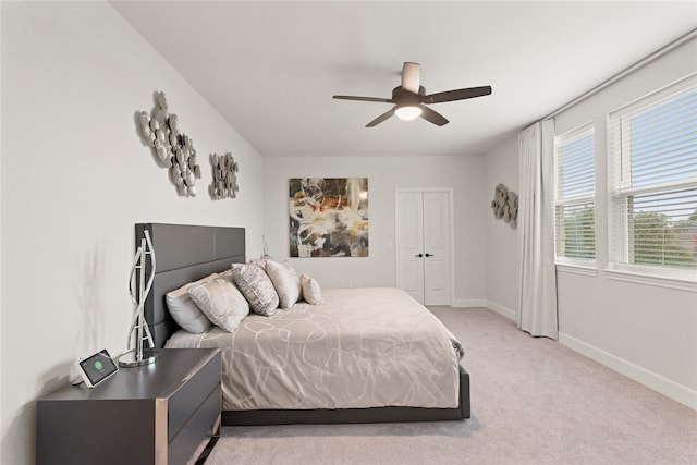 6804 Westview Dr Unit 1307, Houston, TX 77055 - bedroom with light colored carpet, a ceiling fan, and a closet