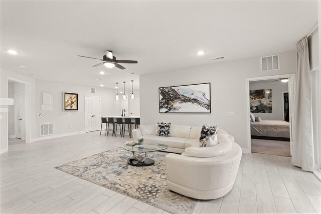 6804 Westview Dr Unit 1307, Houston, TX 77055 - living area featuring ceiling fan, light wood-type flooring, and recessed lighting