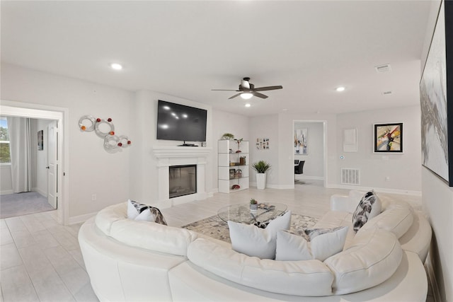 6804 Westview Dr Unit 1307, Houston, TX 77055 - living room with a glass covered fireplace, ceiling fan, and recessed lighting