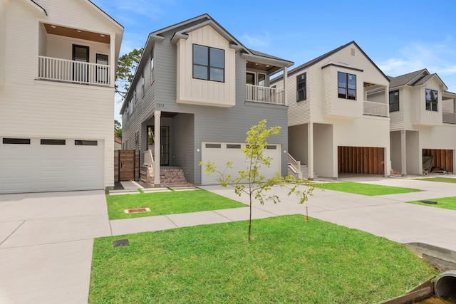 1313 Waverly St, Houston, TX 77008 - view of front of property with a balcony, a garage, board and batten siding, and driveway