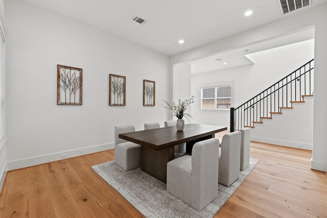 1313 Waverly St, Houston, TX 77008 - dining area featuring stairway, light wood finished floors, and recessed lighting