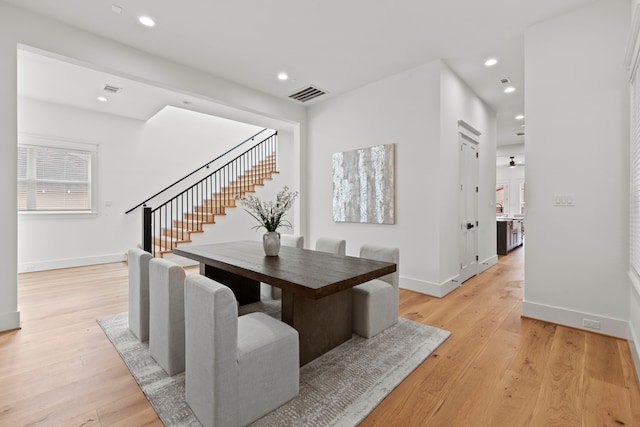 1313 Waverly St, Houston, TX 77008 - dining space featuring stairway, light wood finished floors, and recessed lighting
