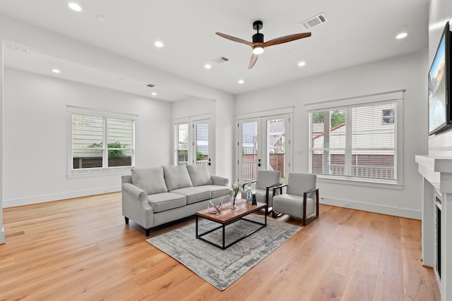 1313 Waverly St, Houston, TX 77008 - living area with healthy amount of natural light, light wood-type flooring, recessed lighting, a fireplace, and ceiling fan