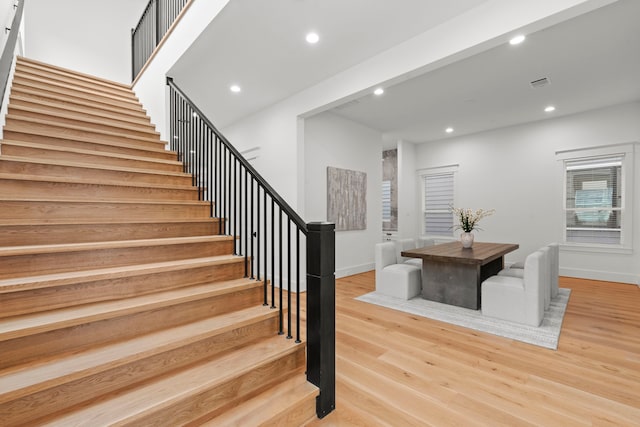 1313 Waverly St, Houston, TX 77008 - staircase featuring wood finished floors and recessed lighting