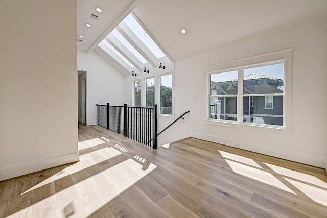 1313 Waverly St, Houston, TX 77008 - spare room with a skylight, recessed lighting, and light wood finished floors