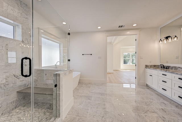 1313 Waverly St, Houston, TX 77008 - full bath featuring a soaking tub, vanity, a stall shower, recessed lighting, and marble finish floors