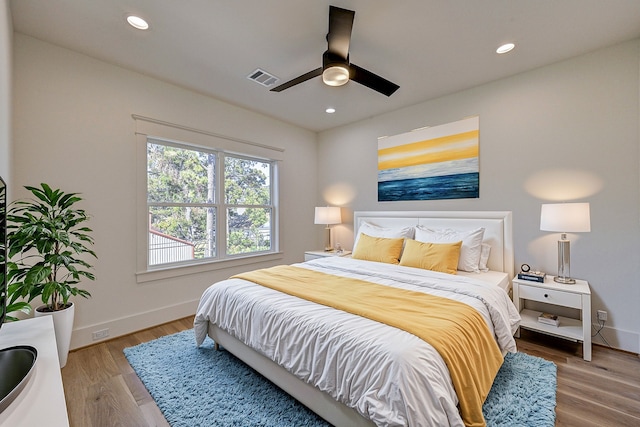 1313 Waverly St, Houston, TX 77008 - bedroom with recessed lighting, wood finished floors, and a ceiling fan