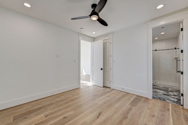 1313 Waverly St, Houston, TX 77008 - unfurnished bedroom with light wood-style flooring, recessed lighting, connected bathroom, and a ceiling fan