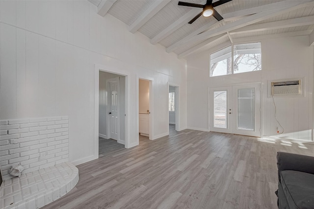 492 Trinity Rd, Dayton, TX 77535 - unfurnished living room featuring high vaulted ceiling, a ceiling fan, a wall mounted air conditioner, wood finished floors, and a wooden ceiling with exposed beams