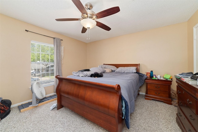 11303 Golden Ray Dr, Cypress, TX 77429 - carpeted bedroom with baseboards and ceiling fan