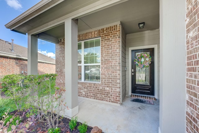 3502 Singing Flower Ln, Richmond, TX 77406 - doorway to property featuring brick siding and covered porch