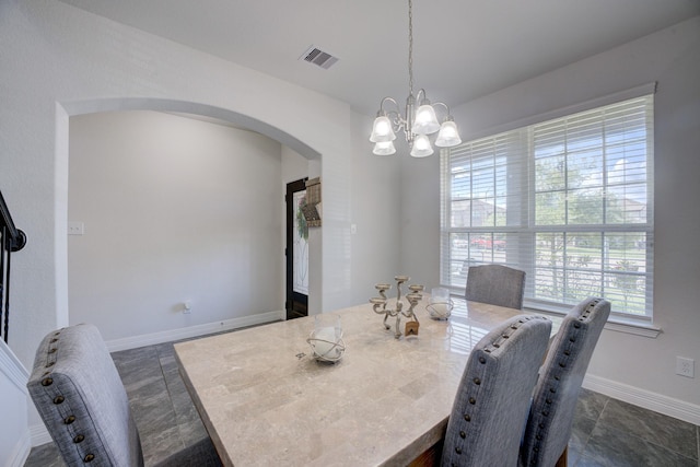 3502 Singing Flower Ln, Richmond, TX 77406 - dining space featuring arched walkways and a chandelier