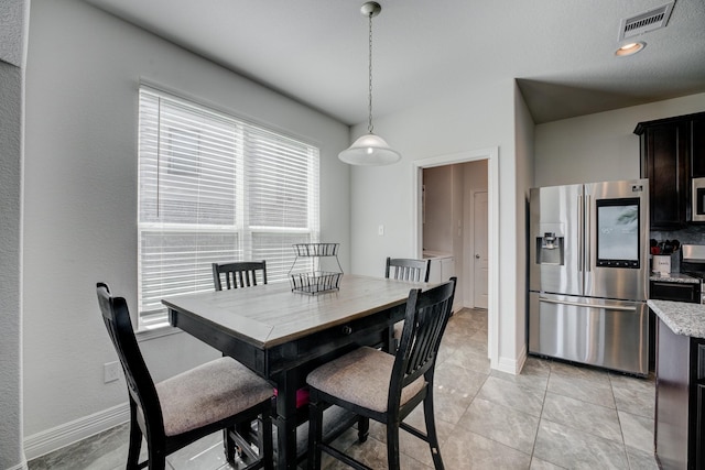 3502 Singing Flower Ln, Richmond, TX 77406 - dining area featuring baseboards and light tile patterned flooring