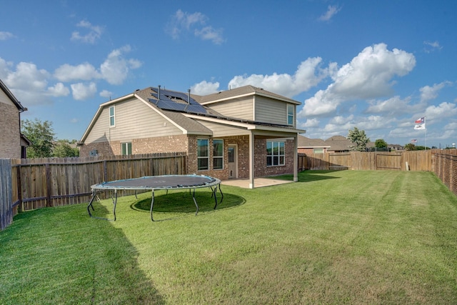 3502 Singing Flower Ln, Richmond, TX 77406 - back of house featuring brick siding, a fenced backyard, and a patio area