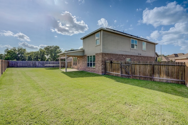 3502 Singing Flower Ln, Richmond, TX 77406 - fenced backyard featuring a trampoline and a patio