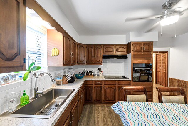 5673 Fm 1094th Rd, Sealy, TX 77474 - kitchen featuring black appliances, dark wood finished floors, a ceiling fan, light countertops, and under cabinet range hood