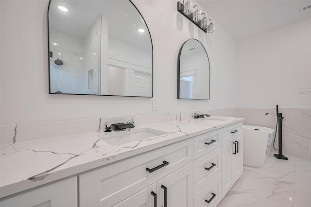 6749 Liverpool St, Houston, TX 77021 - bathroom with double vanity, marble look tiles, a marble finish shower, and a soaking tub