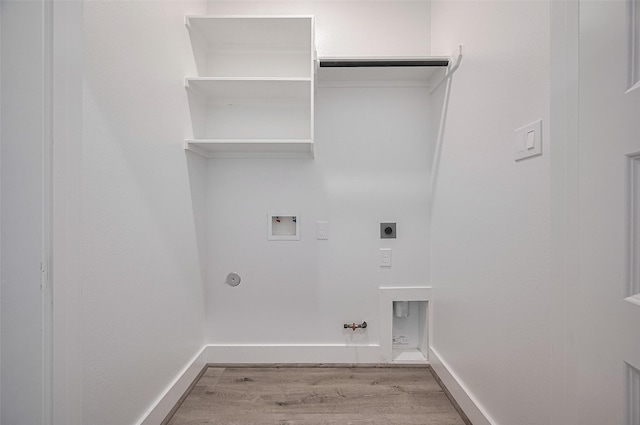 6749 Liverpool St, Houston, TX 77021 - laundry room with gas dryer hookup, light wood-type flooring, hookup for a washing machine, and electric dryer hookup