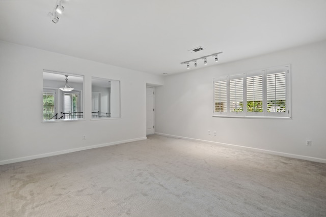 1016 Barkdull St, Houston, TX 77006 - carpeted empty room featuring track lighting and baseboards